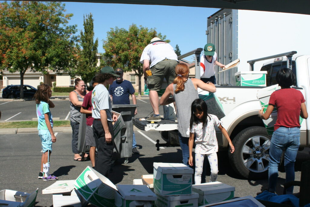 Shred Event image of people loading truck